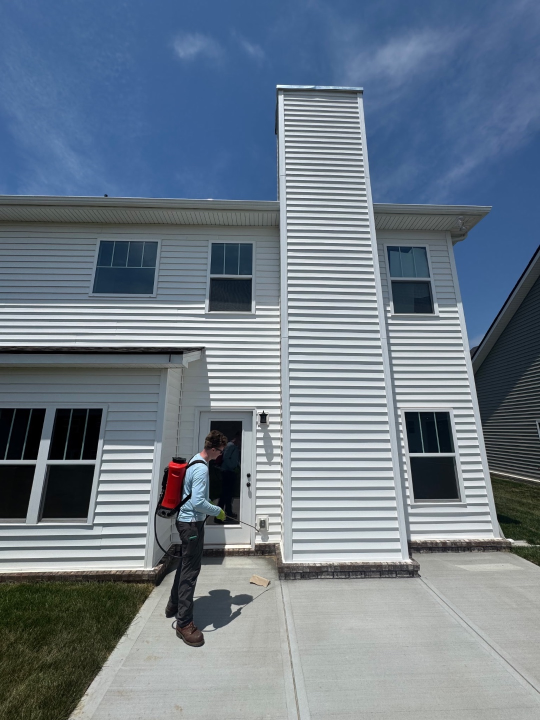 Bay performing an exterior perimeter treatment at a Roane County home